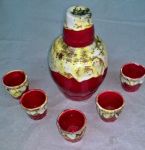 Moringa e 6 copinhos de cerâmica vitrificada vermelha e bege. Total 7 peças.