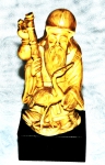 Escultura de marfinite , representando sábio com ave. ALT 8 cm  sem base , alt  10 cm com base