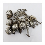 Balangandã "penca baiana" , em metal espessurado a prata, com diversos adereços.