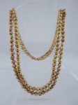Semi-jóia - Dois colares em pérolas dark gold, medindo 80cm.