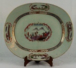 Travessa oval  em porcelana Cia. das Índias, "serviço Descobrimento das Indias", med. 38 x 31 cm. Século XVIII.