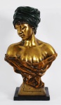 Busto de bronze representando Figura Feminina sobre base de mármore negro. Med.total 50 x 28 cm.