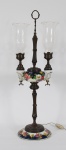 Lampião de mesa, adaptado para luz elétrica em cerâmica italiana , em policromia e figuras de rostos para 2 luzes( as duas figuras coladas). Medidas 70 x 22 cm.