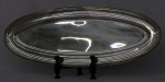 Travessa oval em metal espessurado a prata CHRISTOFLE . Medidas 70 x 27 cm.