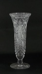 Vaso fusiforme, grosso vidro incolor moldado, elementos geométricos em relevos . Alt. 24 cm