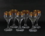 Seis cálices  para licor em grosso cristal , borda decorado com gregas em dourado. Alt.  11 cm.