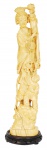 Marfim oriental, esculpido com figura feminina e criança.Acompanha peanha . Alt. 37 cm