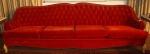 Antigo sofá em estilo inglês em tecido aveludado na cor vermelha ,encosto em capitone e almofadas soltas , pés em madeira patinada  ( marcas do tempo). Medidas 81 x 260 x 76 cm.(APTO- RETIRADA POR CONTA DO COMPRADOR)