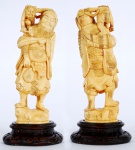Grupo escultórico em marfim oriental representando Homem barbado com figura endiabrada. Base de madeira . Assinado. Alt. 16 cm