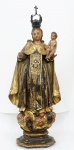 NOSSA SENHORA DO CARMO. Imagem em madeira, ricamente policromada e dourada , acompanha corôa de prata. Século XVIII. Alt. 55 cm