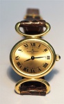 Relogio Baume Mercier, caixa em ouro, pulseira em couro, peso total 21,8 gr.