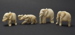 Lote com 4 esculturas em marfim representando Elefantes.