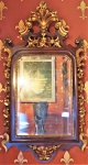 Espelho em estilo francês, madeira entalhada com detalhes em douração. Medidas 130 x 70 cm.