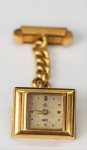 Abotoadura/Relógio, marca UTI Swiss, em ouro, peso total 15.7 gr (relógio não testado)