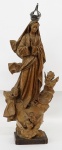 Nossa Senhora da Conceição. Imagem em madeira sem policromia, corôa de prata. Brasil. Século XIX. Alt. 34 cm.