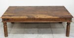 Mesa de centro em madeira nobre com guarnições de ferro. Tampo medindo 45 x 134 x 74 cm.