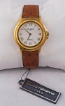 Relógio Paco Rabanne, caixa em plaqué d'or 36mm, pulseira de couro marrom, em perfeito estado.