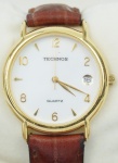 Relógio Technos, caixa em aço dourado 30mm, pulseira de couro marrom, em perfeito estado.