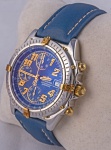 Relógio Breitling Automatic, caixa 40mm em aço e ouro, pulseira de couro azul, em perfeito estado.