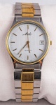 Relógio Mido, caixa 33mm e pulseira em aço com detalhes em dourado, em perfeito estado.