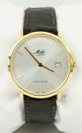 Relógio Mido Ocean Star , caixa 34mm em plaqué d'or, pulseira em couro marrom, em perfeito estado.