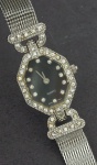 Relógio réplica  de modelo Elizabeth Taylor, caixa 18mm, em metal . No estado.