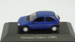 Chevrolet Corsa 1.0, 1994. Acondicionado em caixa de acrílico.Comprimento 9 cm.
