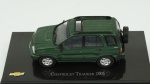 Chevrolet Tracker, 2001. Acondicionado em caixa de acrílico.Comprimento 10 cm.