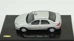 Chevrolet Prisma, 2012. Acondicionado em caixa de acrílico.Comprimento 10 cm.