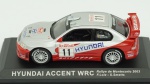 Hyundai Accent WRC, Rallye de Monte Carlo 2003, F.Loix-S. Smetts. Acondicionado em caixa de acrílico.Comprimento 10 cm.