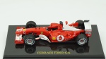 Ferrari F2003-GA. Acondicionado em caixa de acrílico.Comprimento 10 cm.