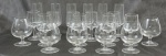 Conjunto em cristal liso sendo: 6 fluts, 6 taças / conhaque, 9 taças p/ vinho branco,total 21 peças.