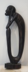 Escultura africana em ébano, representando figura de ancião, altura 27 cm. OBS: RETIRADA NO LOCAL AV ATLANTICA