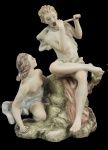 Grupo escultórico em porcelana "Capodimonti", representando figuras mitológicas. Alt. 25 cm