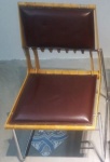 Pedro Useche - (Venezuela, 1956/2020) - Cadeira ripa, assento de couro alemão na cor vinho, estrutura em metal e madeira. Medida