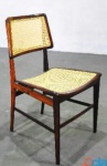 JOAQUIM TENREIRO.  Cadeira trapezoidal em jacarandá , assento e encosto em palha indiana  natural.