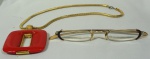 Lote de peças da grife francesa LANVIN, composto de: óculos c/ armação em ouro 14 kt c/ estojo original e gargantilha c/ pingente.
