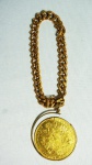 Pulseira com elos e moeda da Áustria 1915 em ouro ( parte do aro solto). peso total 53.3 gramas