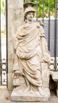 Escultura em pedra, representando " Figura Nobre" , ao gosto da estatuária greco romana, marcas do tempo, medindo 202x88x60 cm