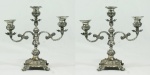 Par de candelabros em prata p/3 velas cada, med. 24 cm de altura, peso total 1.848 gr.