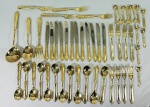 Faqueiro italiano em metal dourado, completo, sem uso, no estojo, total 51 peças