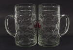 Par de canecas em cristal grosso para cerveja com a impressão da logomarca da Paulaner Müchen. Medida: 20cm de altura.