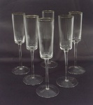 Conjunto de 6 (seis) taças em cristal frisado com borda prateada para champagne. Medida: 24cm de altura.