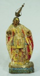 Imagem de Santa Luzia em madeira com resquícios de policromia. Medida com a coroa: 33cm de altura. Medida sem a coroa: 27cm de altura. Falta mão direita.