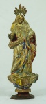 Imagem de Nossa Senhora em madeira com resquícios de policromia e resplendor em metal. Medida: 31 cm de altura. Medida com resplendor: 35 cm de altura.