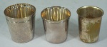 Conjunto de 3 (três) copos em metal das marcas Francalanza, 7cm, Cristofle, 6,5cm e Wolff, 7cm.