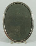 Porta retrato oval em prata 925. Medida: 20x15.