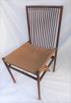 JOAQUIM TENREIRO (1906/1922). Cadeira estruturada em Jacarandá, com 15 varetas, estofado de época, medindo 90 x 44 x 46 cm.