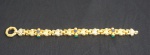Imponente pulseira, possivelmente italiana, em ouro amarelo 18k, contrastado, com pedras vermelhas, verdes e azuis. peso total 33.4 g