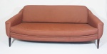SERGIO RODRIGUES (1927/2014). Conjunto de sofá Estella, sofá de 3 lugares e par de poltronas, em couro ecológico marrom. Medidas : sofá 72x195x77cm, poltronas 72x77x80cm.